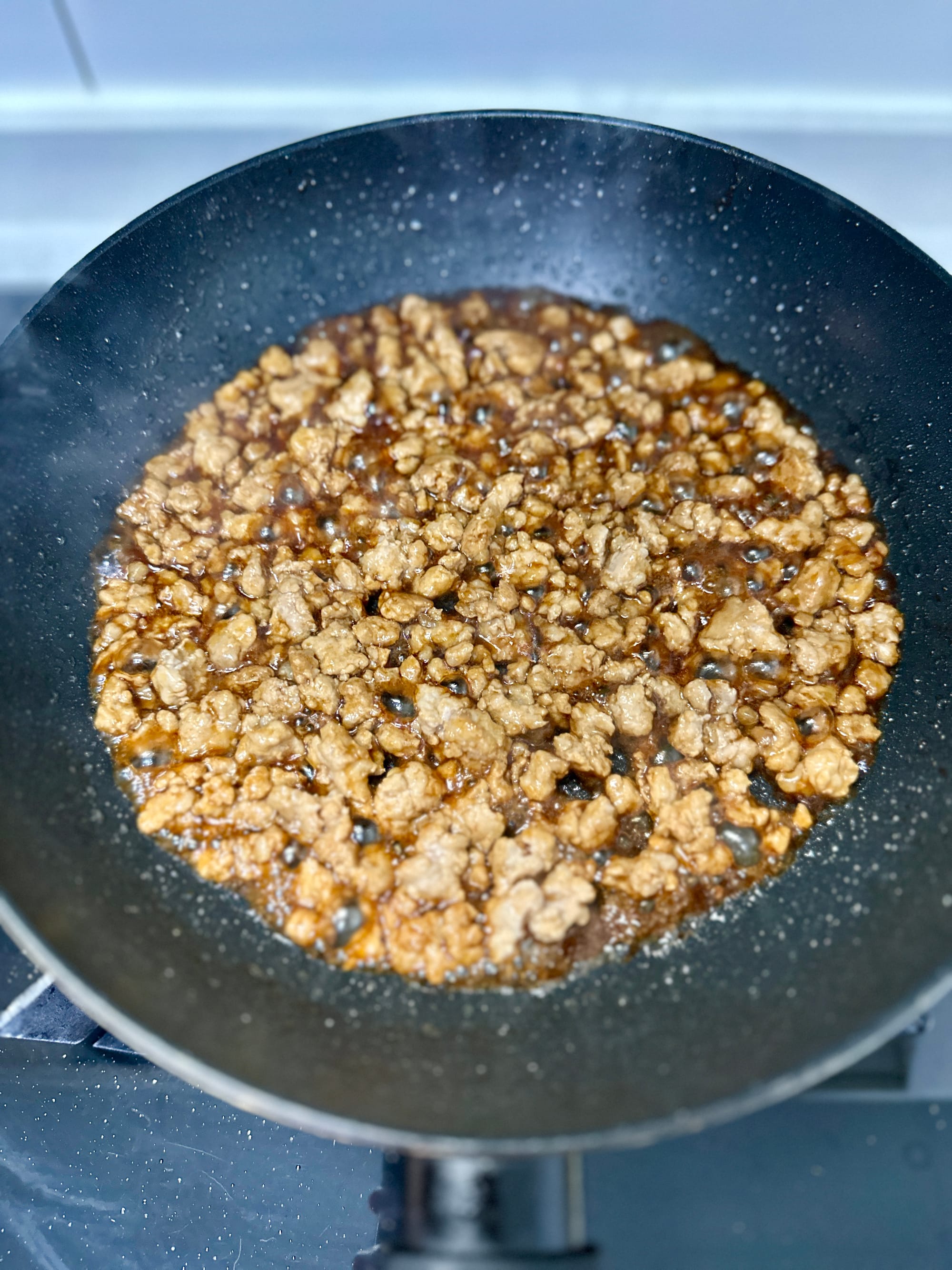 Fermented Long Beans with Minced Pork (Suān dòujiǎo chǎo ròumò / 酸豆角炒肉末)