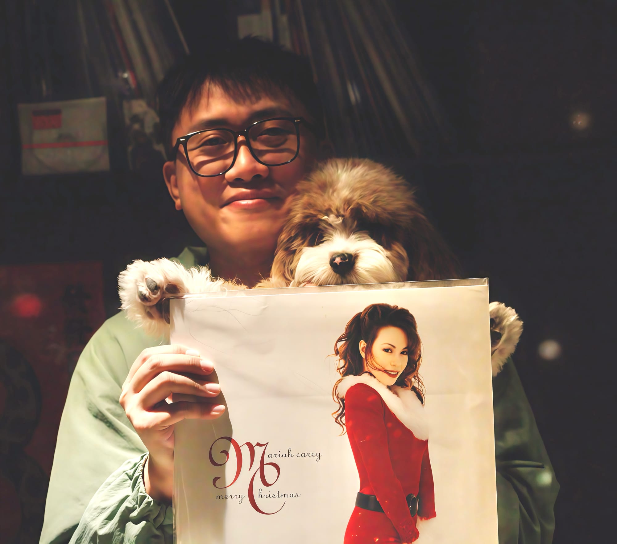 Wei Yuan poses for a photo with his dog and a Mariah Carey Christmas album behind the DJ booth at his restaurant.