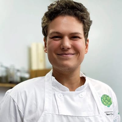 Arnold Kuiper - Instructional Chef at C'est Bon Ottawa posing in his chef's uniform.