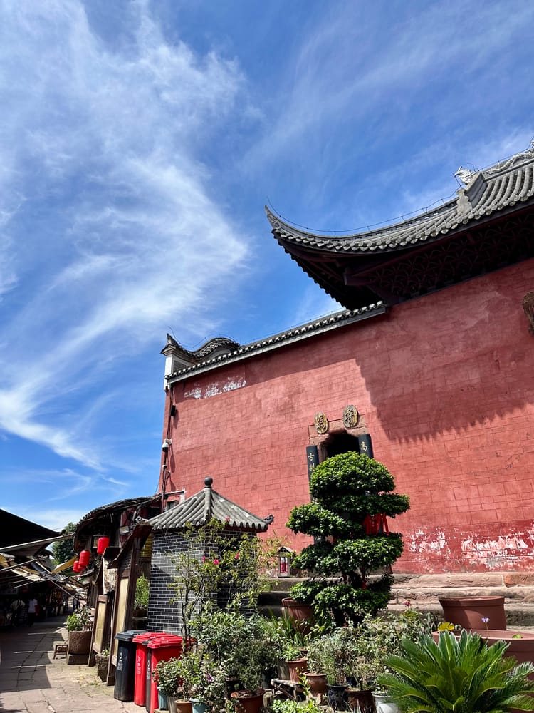 Old red brick building with a Chinese style roof in the historic town of Yaoba in Sichuan, China.